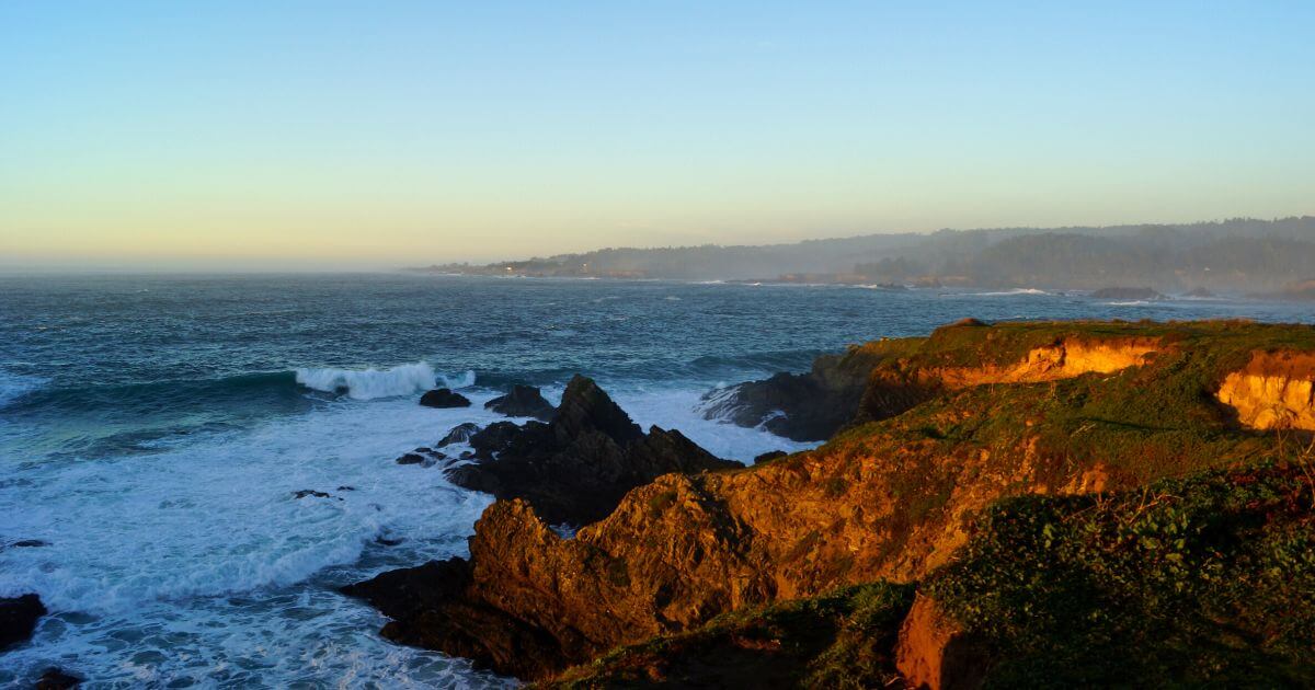 Rugged cliffs and rock formations at sunset at Mendocino Coast