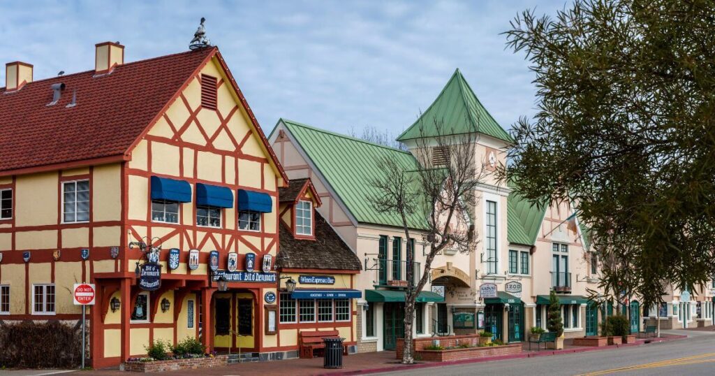 Street view picture of the city of Solvang, one of the best day trips from LA, with colorful buildings.