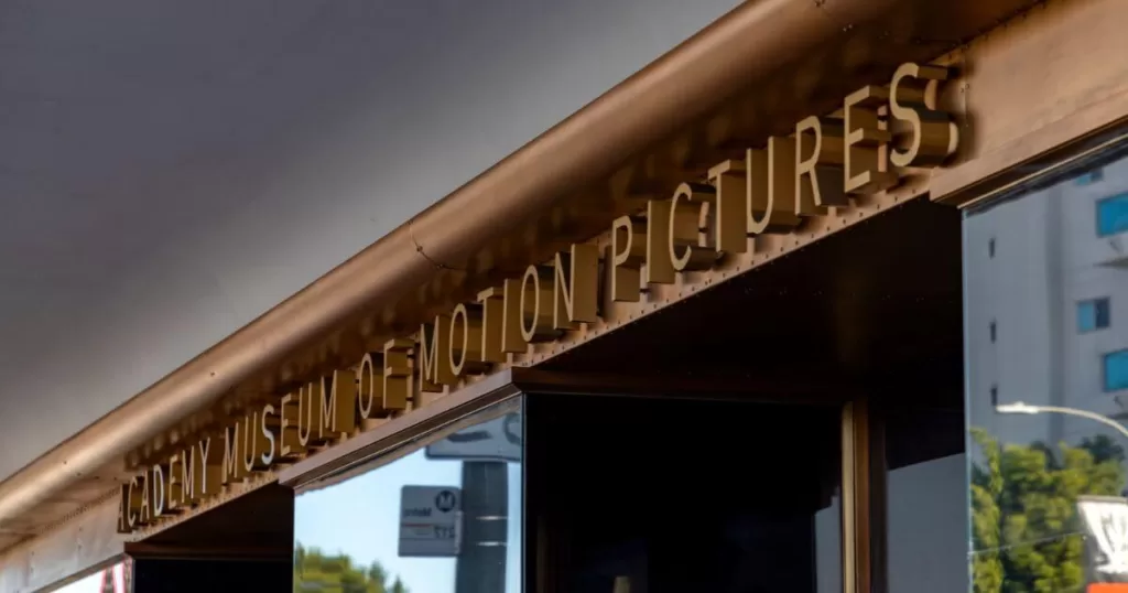 Golden lettering of 'Academy Museum of Motion Pictures' on the facade of the museum, capturing the essence of Hollywood's film culture.