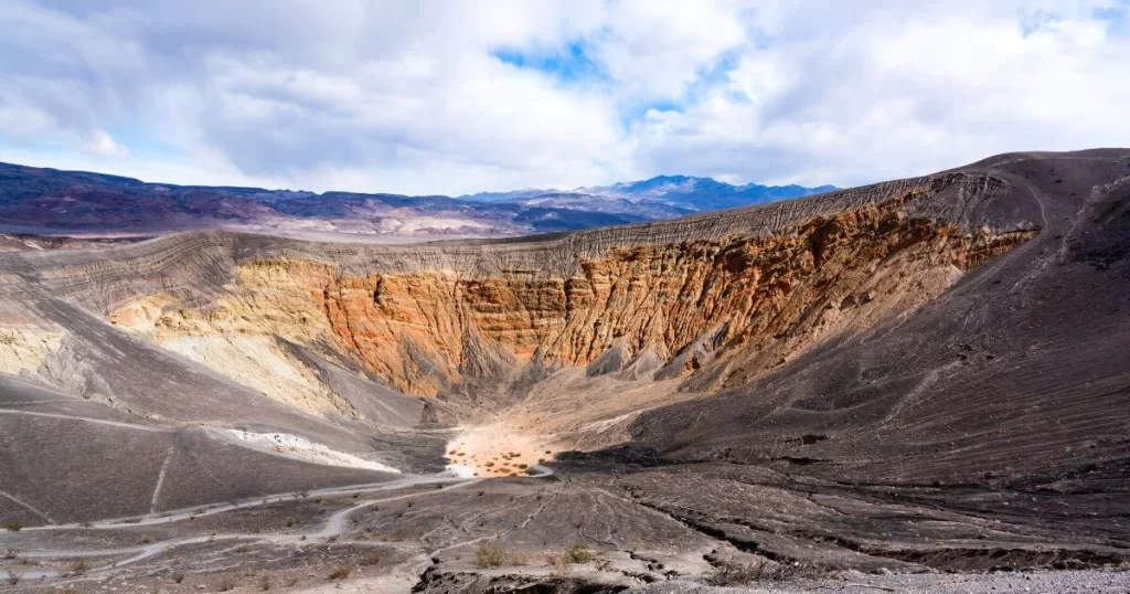 Ubehebe Crater in Death Valley, a vast volcanic crater with layered rock walls, a key attraction and one of the best places to visit in Death Valley National Park.